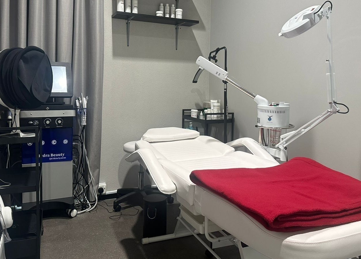 Modern treatment room at My Face, Riyadh, Riyadh Province, SA, featuring a spa bed and skincare equipment.