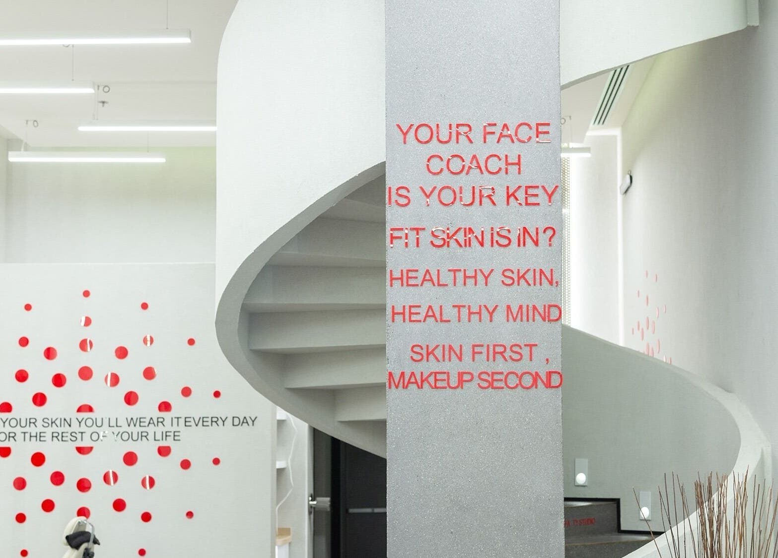 Modern spiral staircase with motivational quotes at My Face in Riyadh, Riyadh Province, SA.