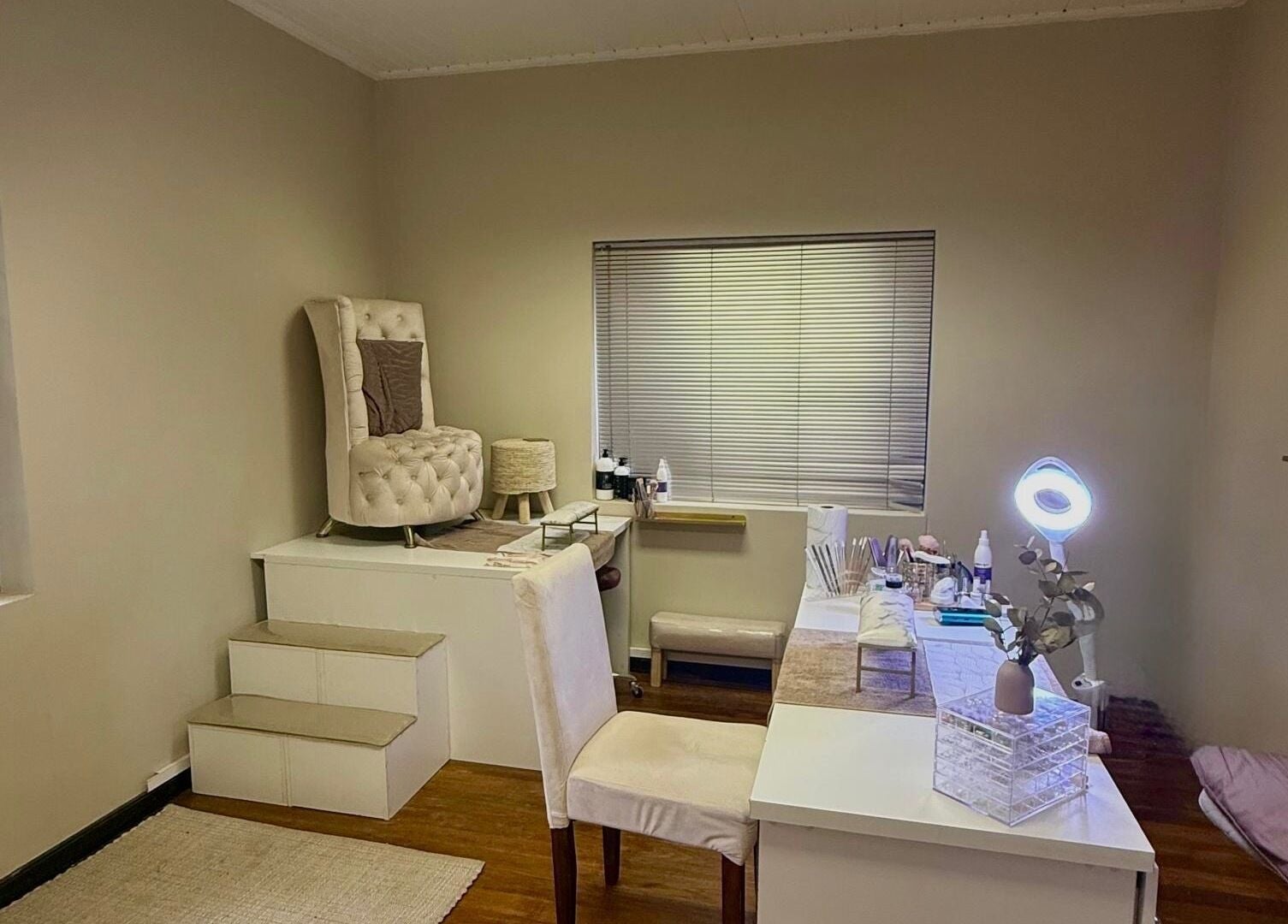 Elegant spa room at Aura Beauty & Wellness, Windhoek, Khomas Region, NA, featuring plush seating and decor.