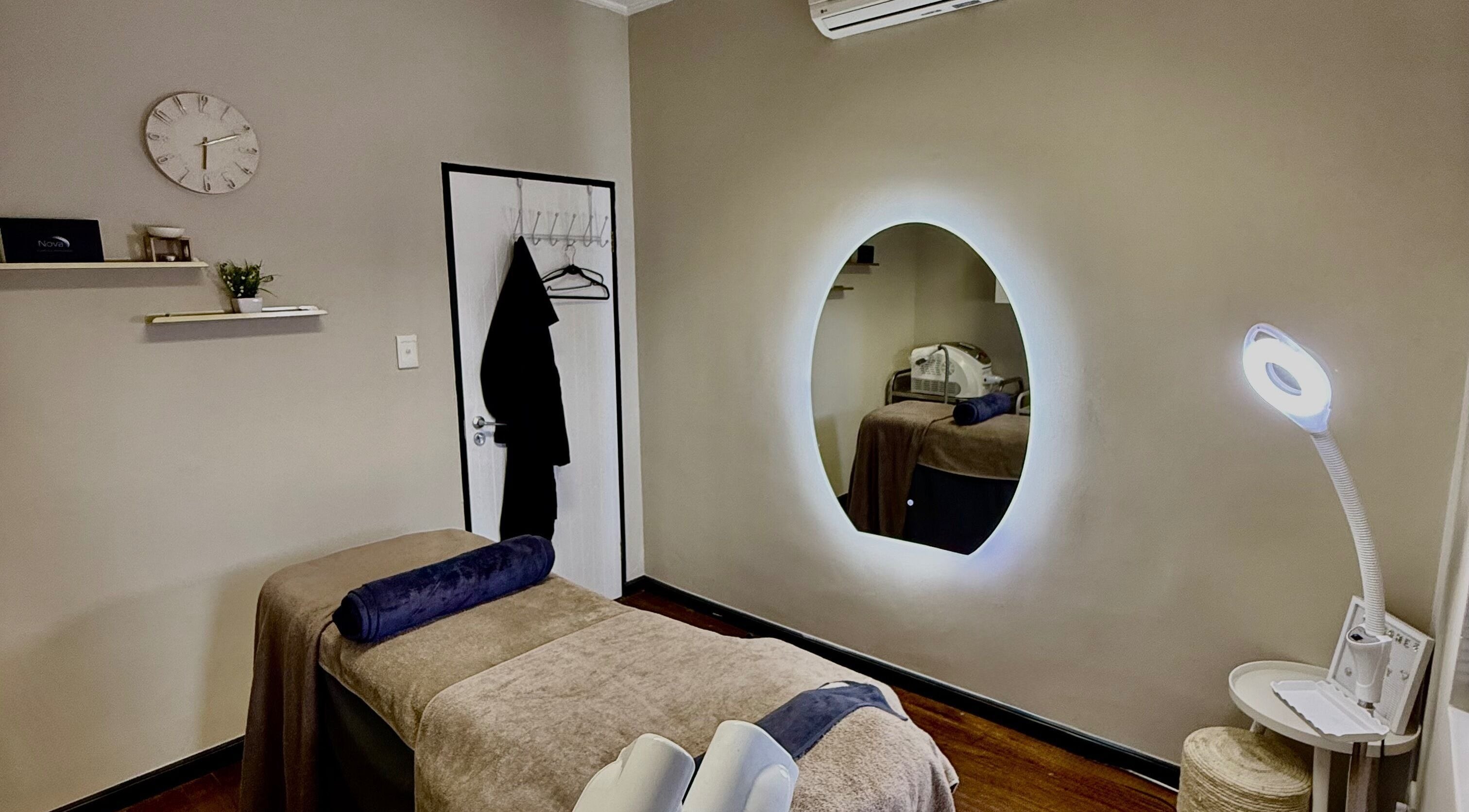 Calming treatment room at Aura Beauty & Wellness, Windhoek, Khomas Region, NA, with soothing decor and lighting.