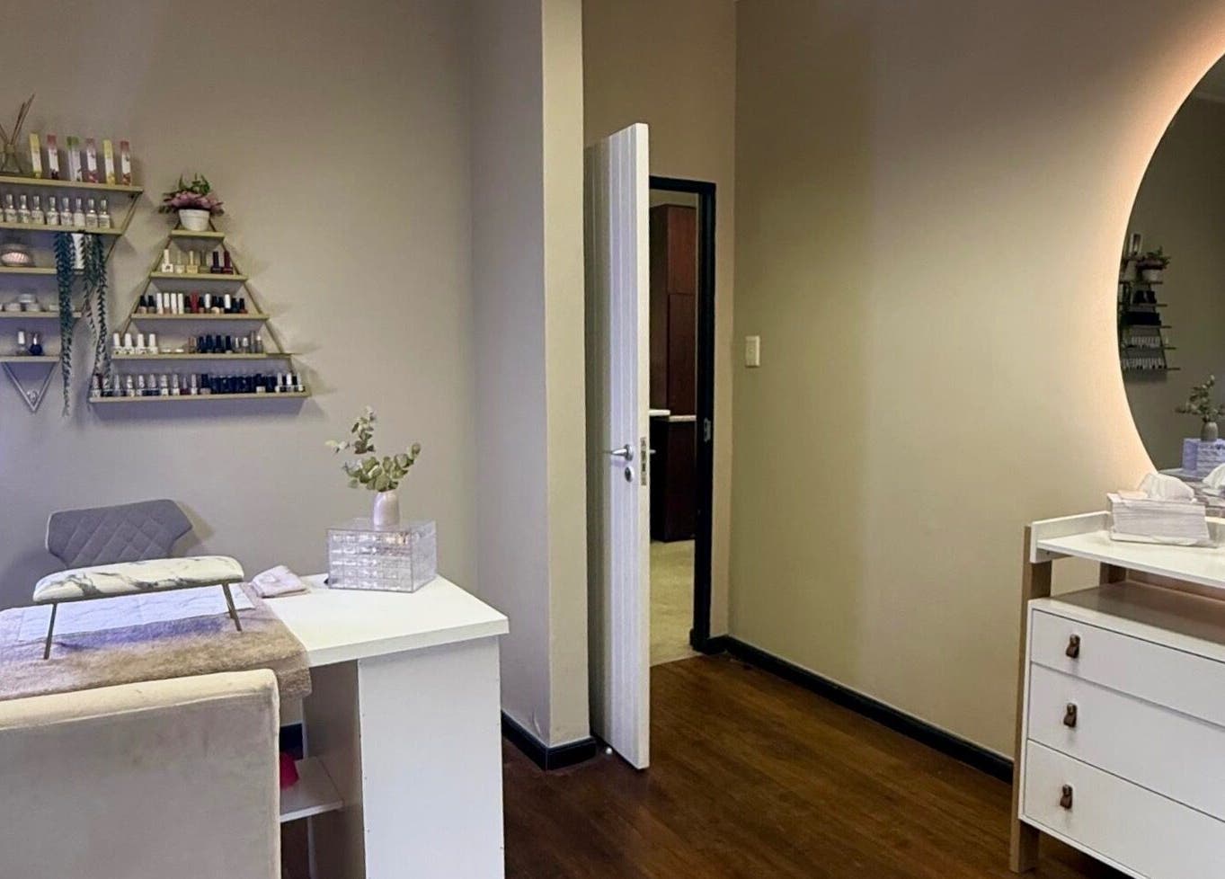 Elegant nail care station at Aura Beauty & Wellness, Windhoek, Khomas Region, NA with modern decor and lighting.