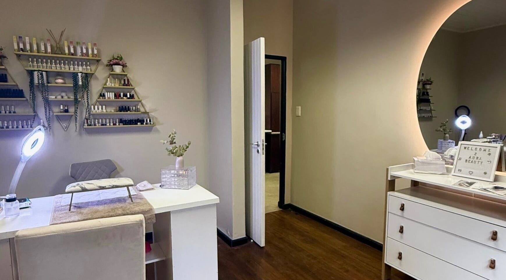 Elegant nail care station at Aura Beauty & Wellness, Windhoek, Khomas Region, NA with modern decor and lighting.