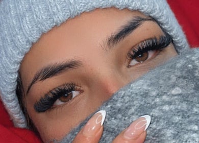 Stylish woman with elegant eyelashes and manicure at Samaj Beauty Projects, Cape Town, Western Cape, ZA.