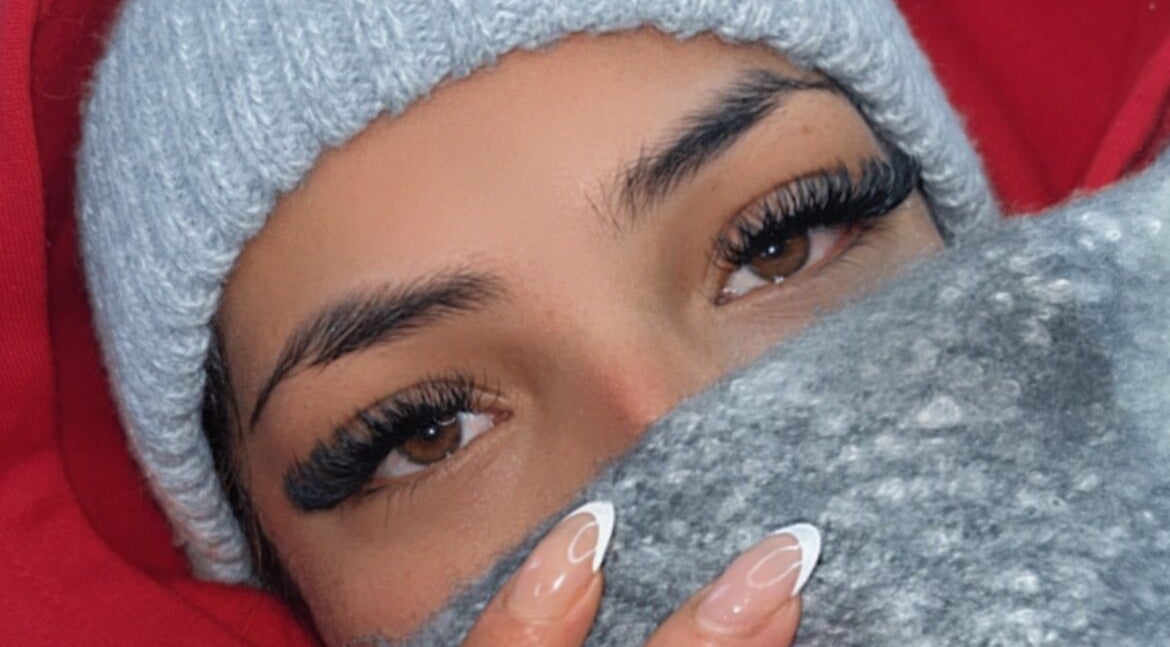 Stylish woman with elegant eyelashes and manicure at Samaj Beauty Projects, Cape Town, Western Cape, ZA.