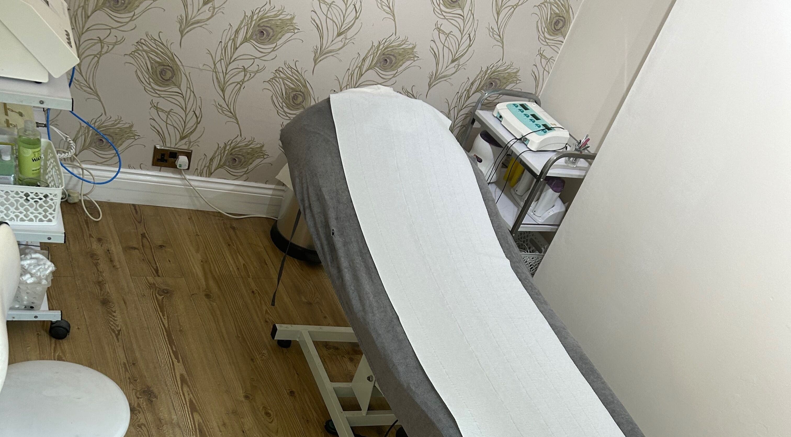 Tranquil treatment room at Beauty Worx, Taunton, England, GB, with modern equipment and soothing decor.