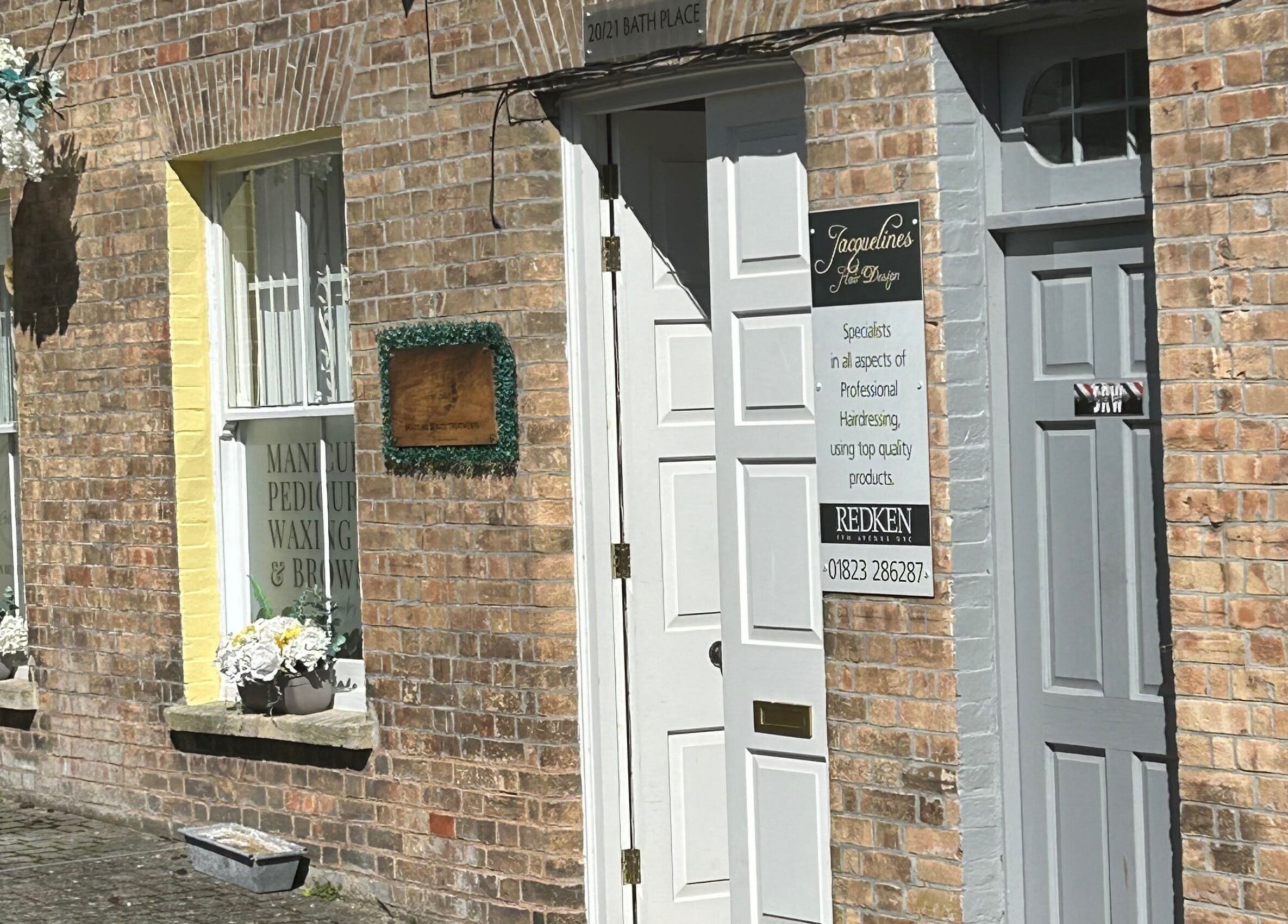 Exterior of Beauty Worx in Taunton, England, GB with brick facade and welcoming entrance.