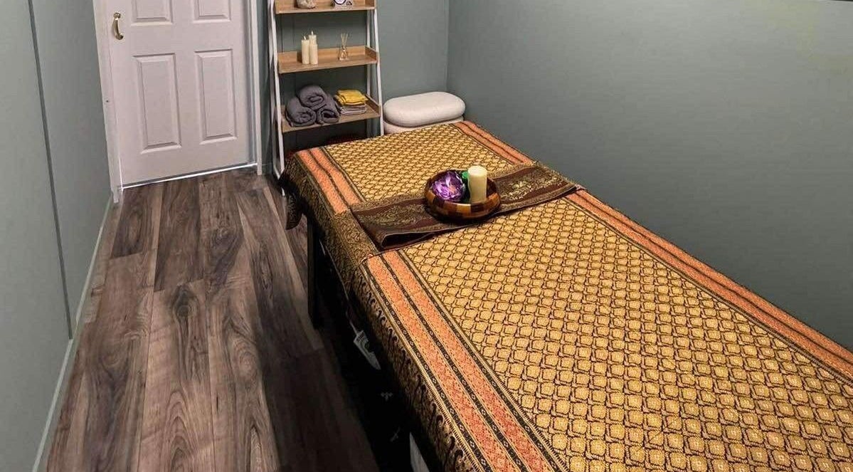 Serene massage room at Jasmine’s Thai Massage & Beauty in Lewes, England, GB, featuring a comfortable treatment bed.
