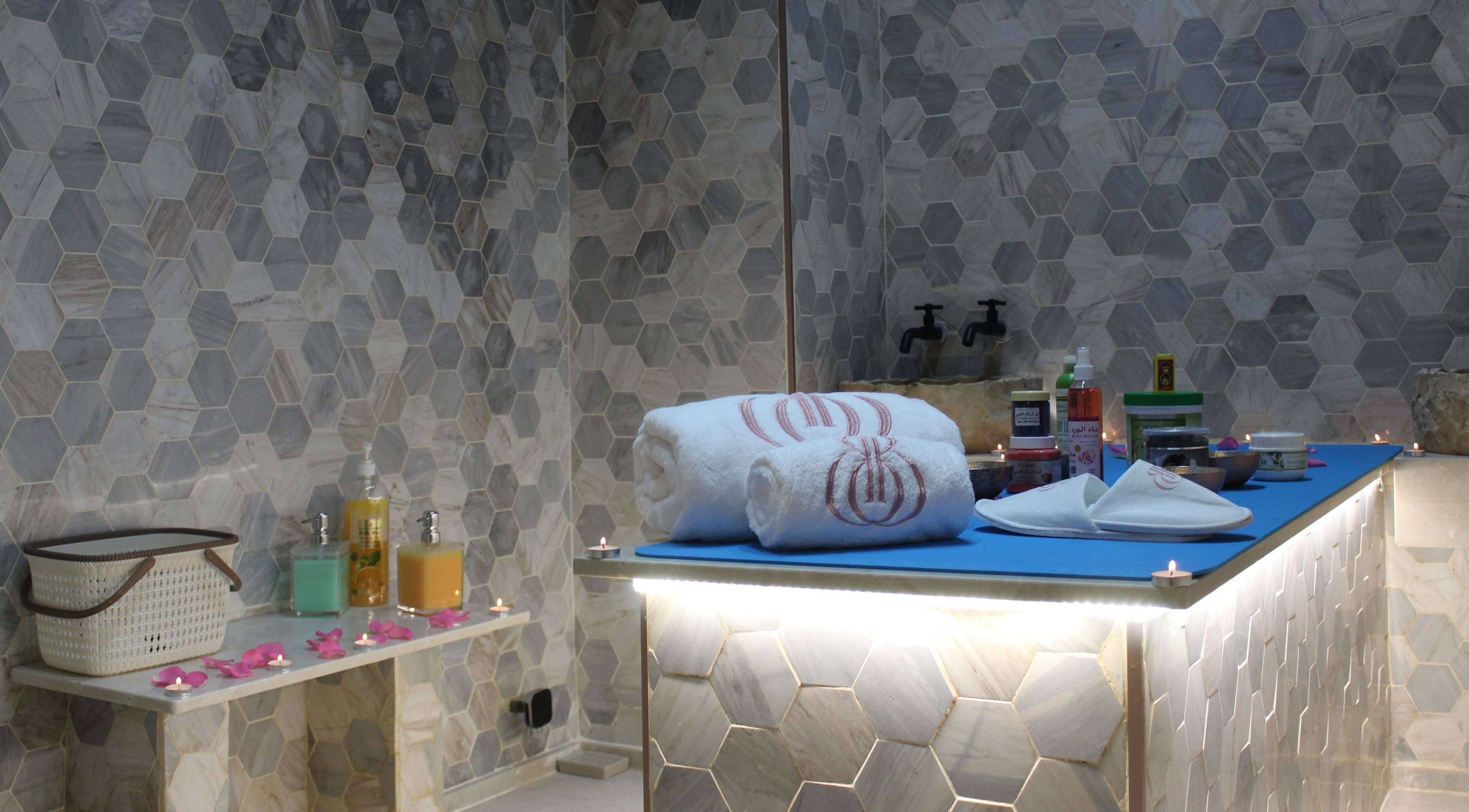 Luxurious spa setup at Beautiquette Beauty Salon, Dubai, Dubai, AE, with towels and products.