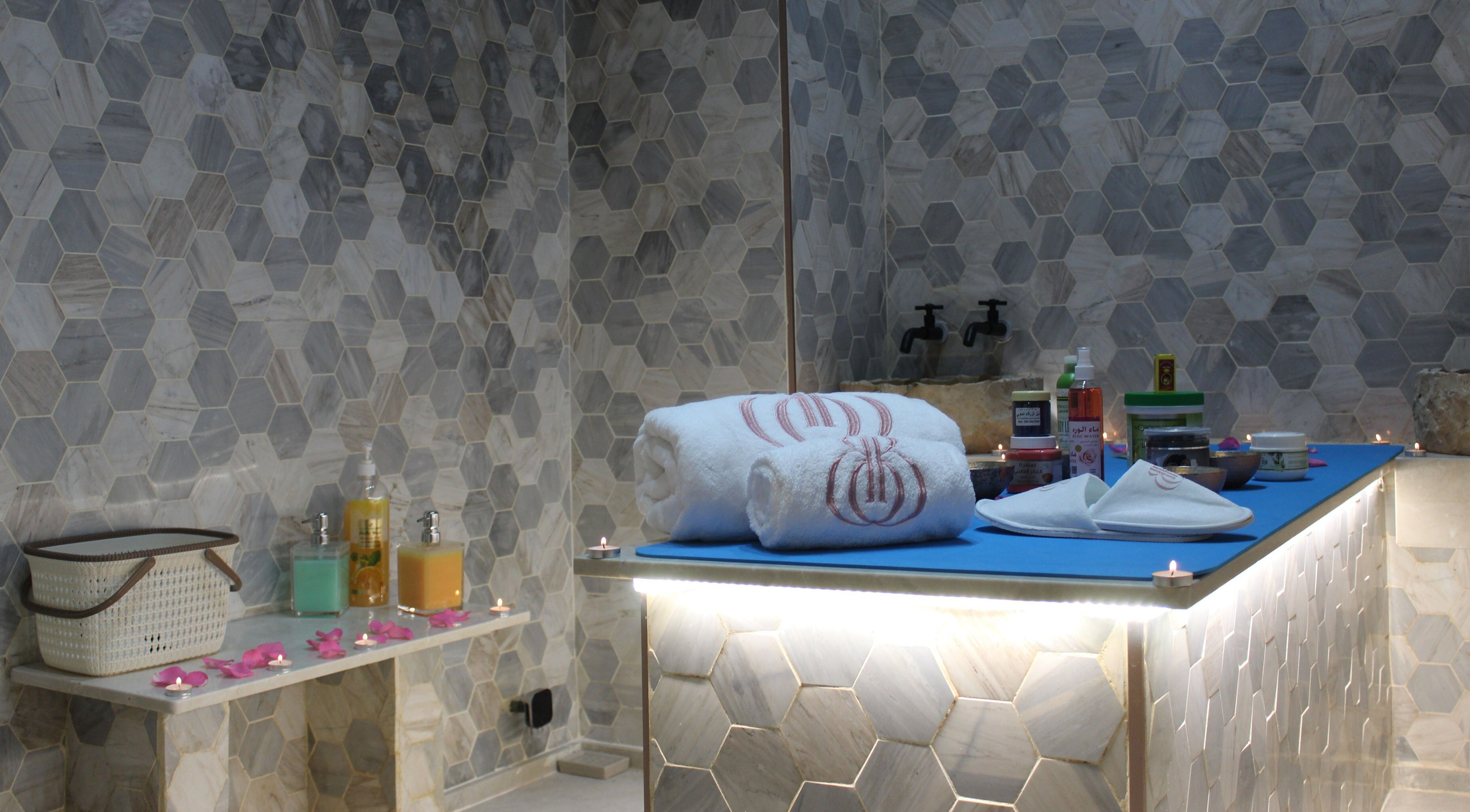 Luxurious spa setup at Beautiquette Beauty Salon, Dubai, Dubai, AE, with towels and products.