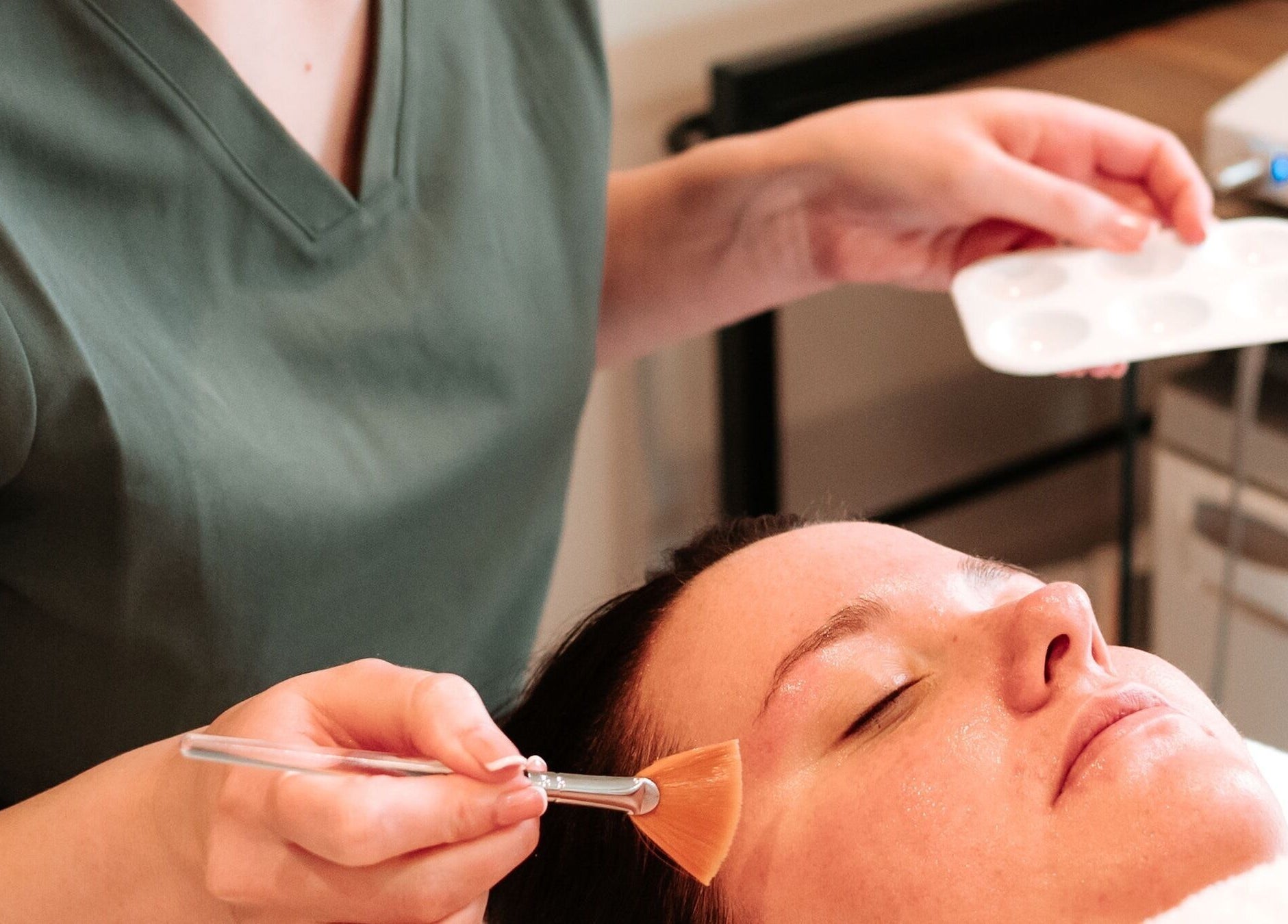 Relaxing facial treatment at Bare Faced by Elle, Middlesbrough, England, GB with soothing brush application.