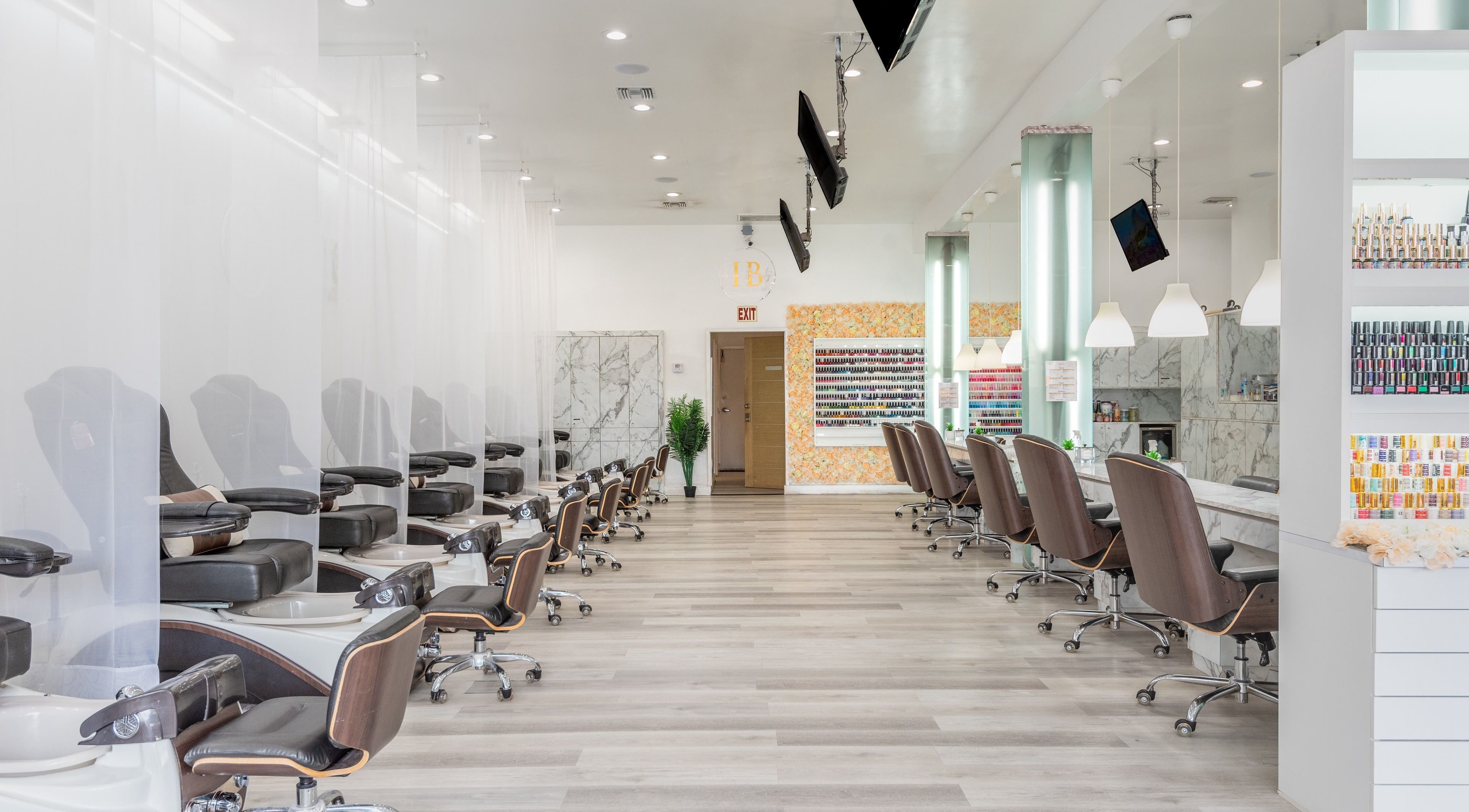 Chic interior of Ibiza Nails in West Hollywood, California, US showcasing elegant nail salon chairs and decor.