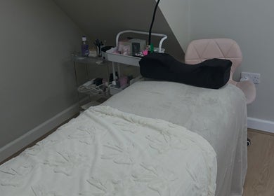 Relaxing spa treatment room at JLP Studio, Morpeth, England, GB. Inviting bed and organized tools.
