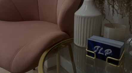 Elegant pink chair and decor at JLP Studio in Morpeth, England, GB showcasing a serene ambiance.