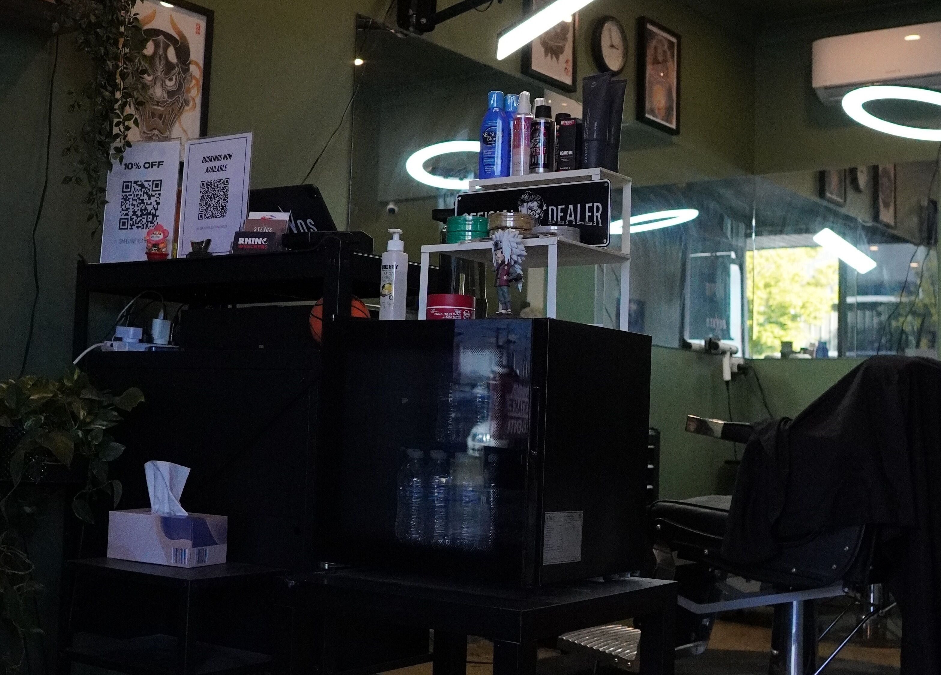 Interior of Stevo’s Barbershop in Moorooka, Queensland, AU featuring styling products and modern barber chair.