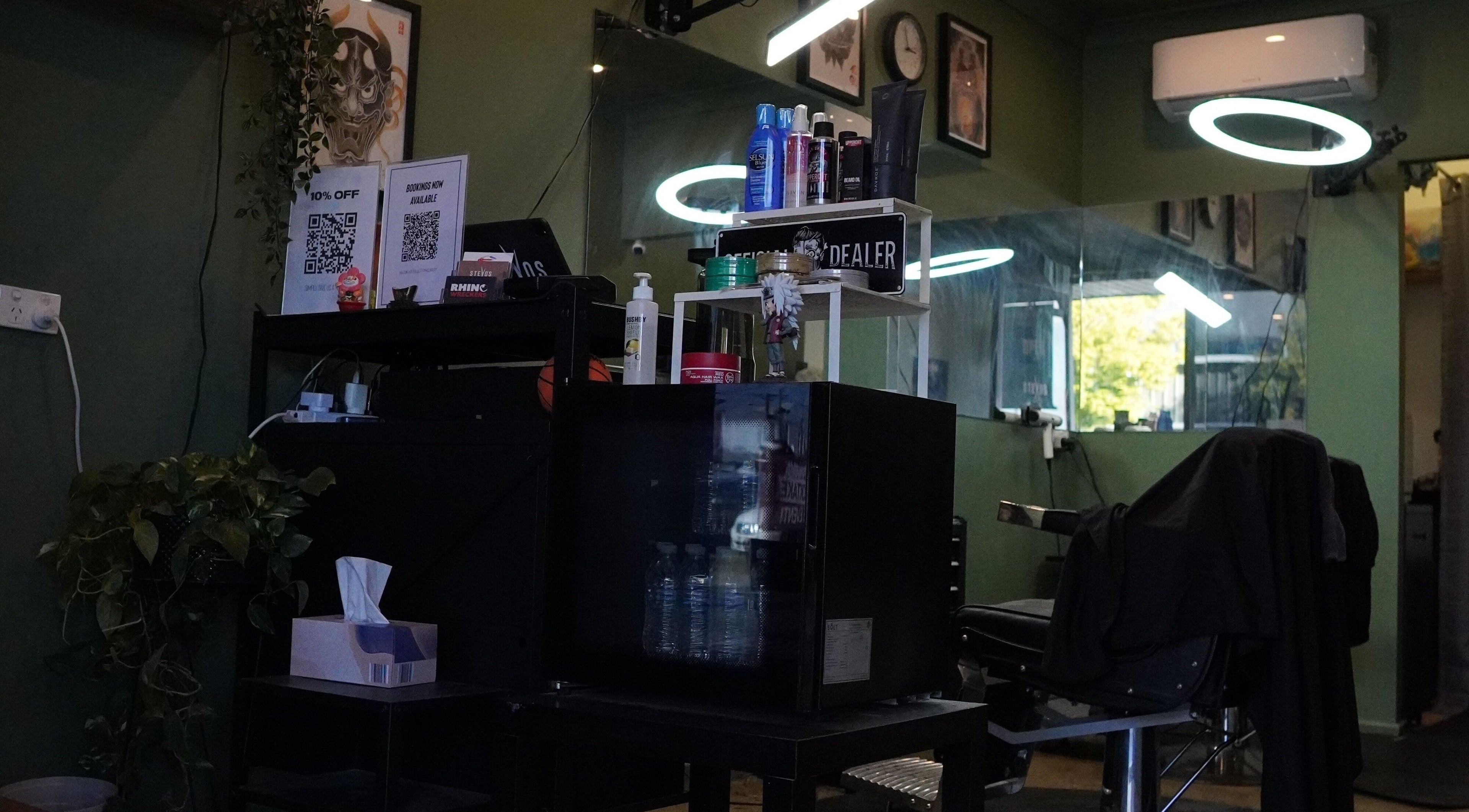 Interior of Stevo’s Barbershop in Moorooka, Queensland, AU featuring styling products and modern barber chair.
