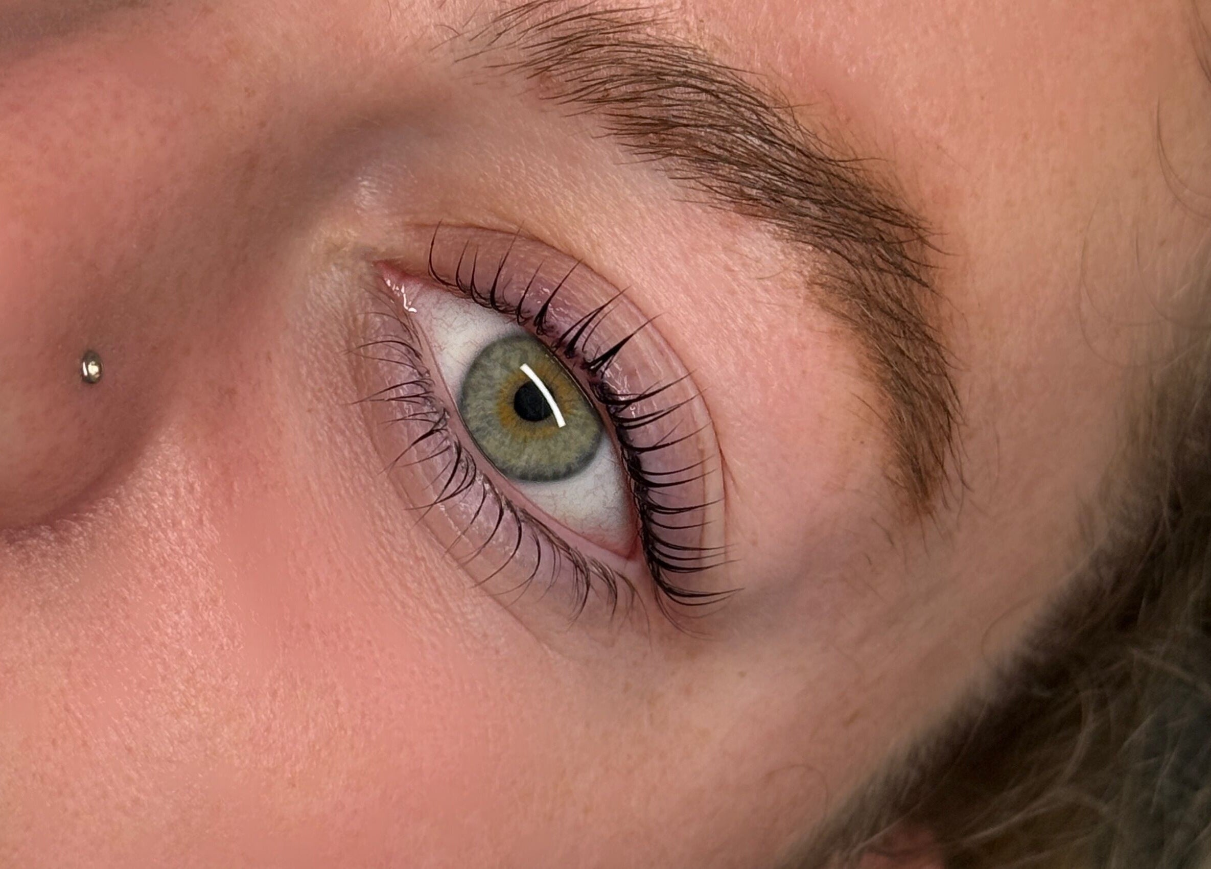 Closeup of elegantly styled natural eyelashes at The Lash Abode by Jade, Berkeley, New South Wales, AU.