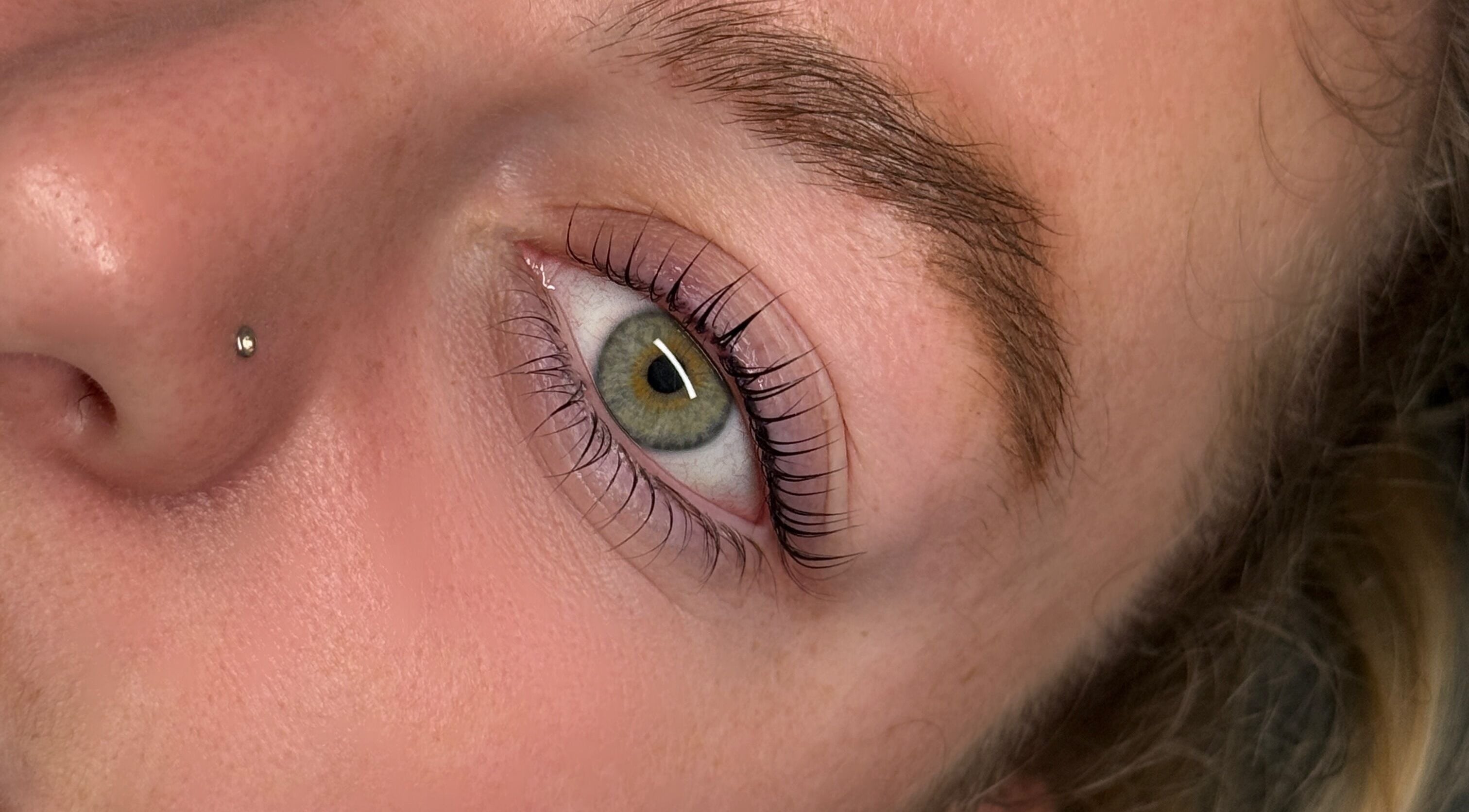 Closeup of elegantly styled natural eyelashes at The Lash Abode by Jade, Berkeley, New South Wales, AU.