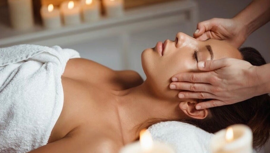 Relaxing head massage at Shape & Slim Massage Studio in Leicester, England, GB surrounded by ambient candles.