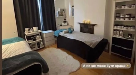 Cozy therapy room at Shape & Slim Massage Studio, Leicester, England, GB with massage tables and calming decor.