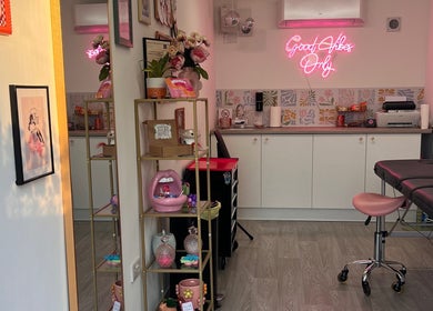 Chloe Duncan Tattoo studio in Rochester, England, GB with modern decor and vibrant neon sign.