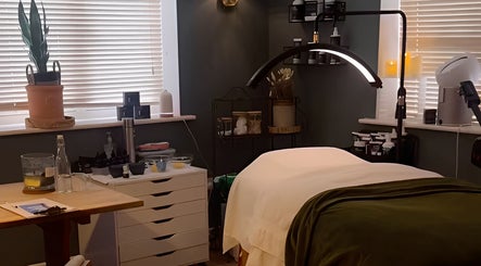 Relaxing treatment room at The Pampered Cow, Hixon, England, GB, featuring a massage table and calm ambiance.
