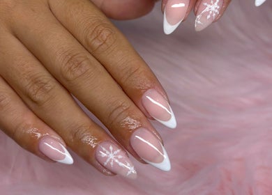Beautiful, pink manicure with snowflake design at Jennifer Audrey Nails & Beauty, Thurmaston, England, GB.