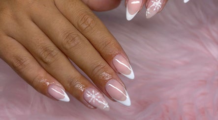 Beautiful, pink manicure with snowflake design at Jennifer Audrey Nails & Beauty, Thurmaston, England, GB.