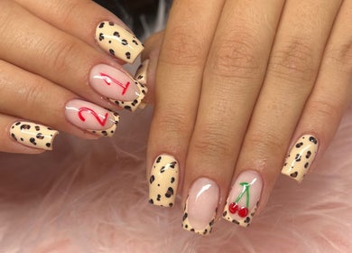 Stylish cheetah and cherry nail art at Jennifer Audrey Nails & Beauty, Thurmaston, England, GB.