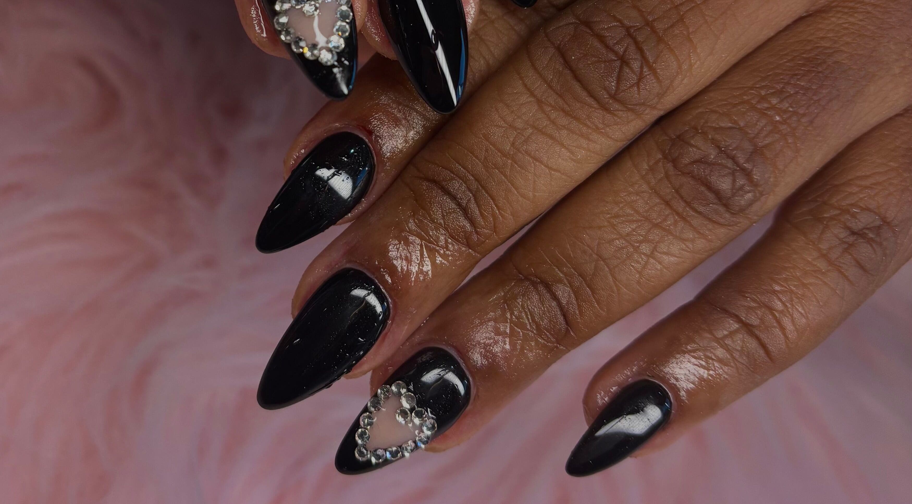 Elegant black nail art with gem accents at Jennifer Audrey Nails & Beauty, Thurmaston, England, GB.