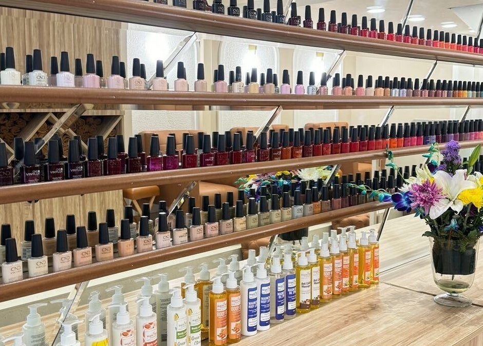 Colorful nail polish display at The Mani Pedi Spa, AIPL Joy Street, Gurugram, Haryana, IN.