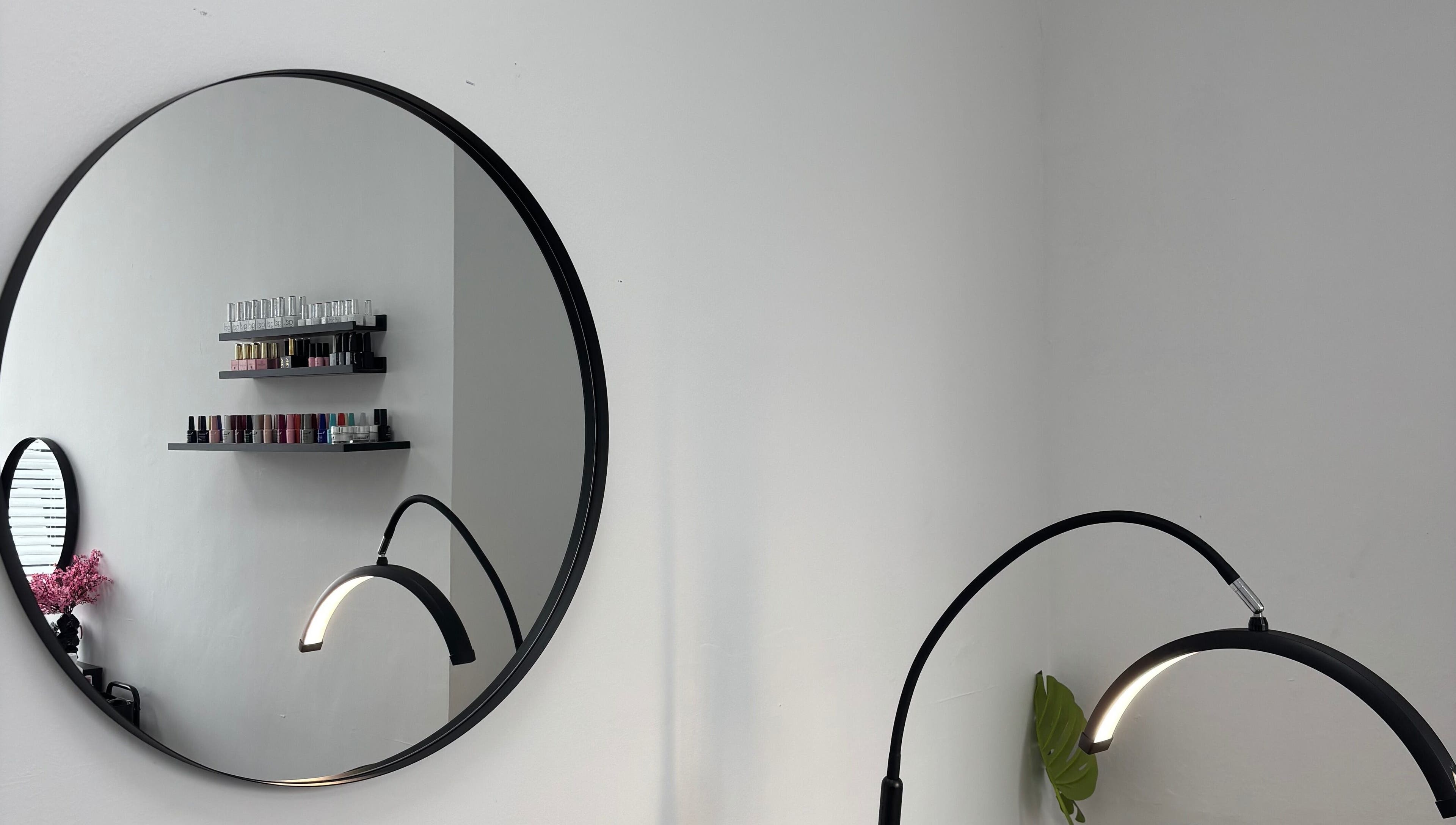 Chic interior of Blush Dundee featuring a round mirror and nail polish display in Dundee, Scotland, GB.