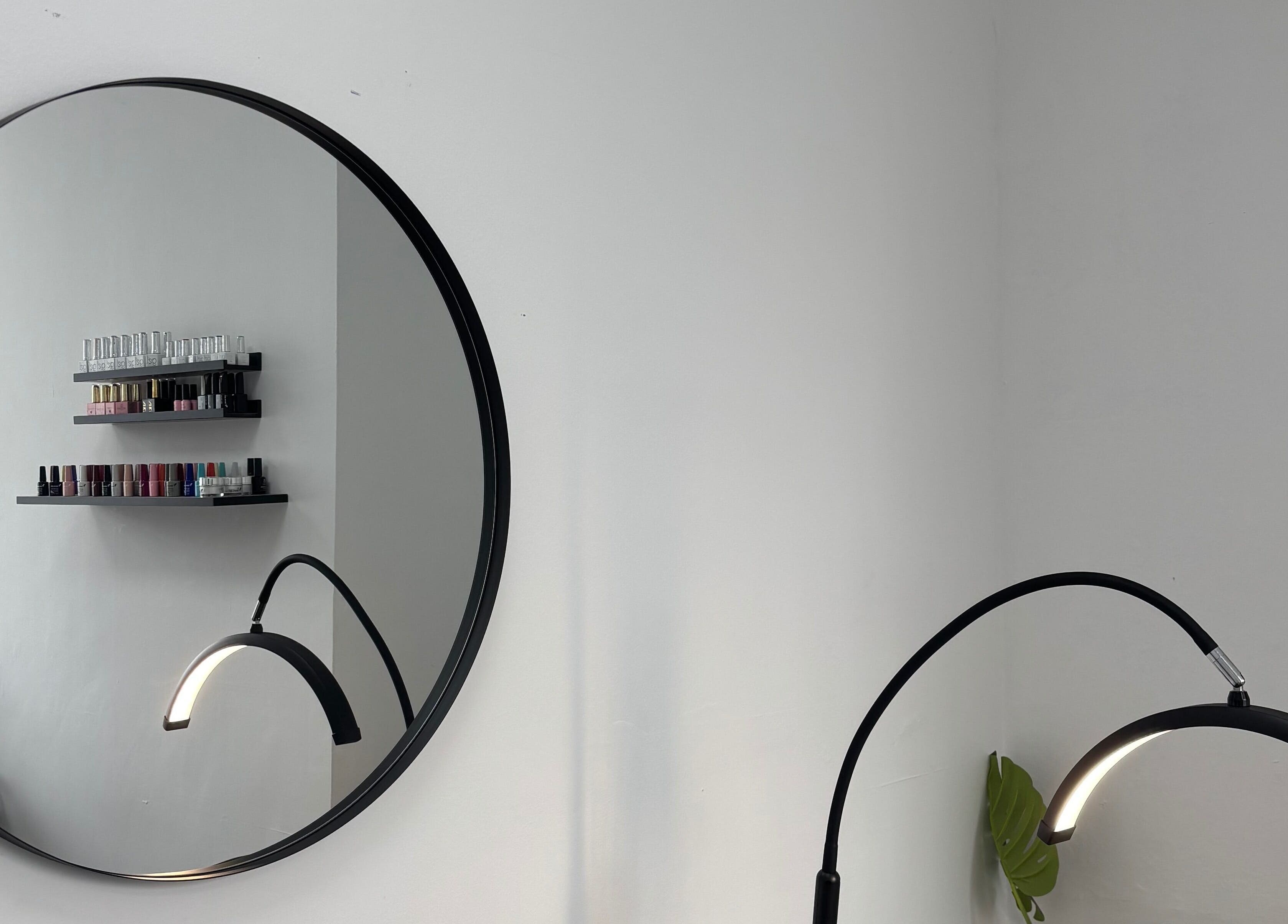 Chic interior of Blush Dundee featuring a round mirror and nail polish display in Dundee, Scotland, GB.