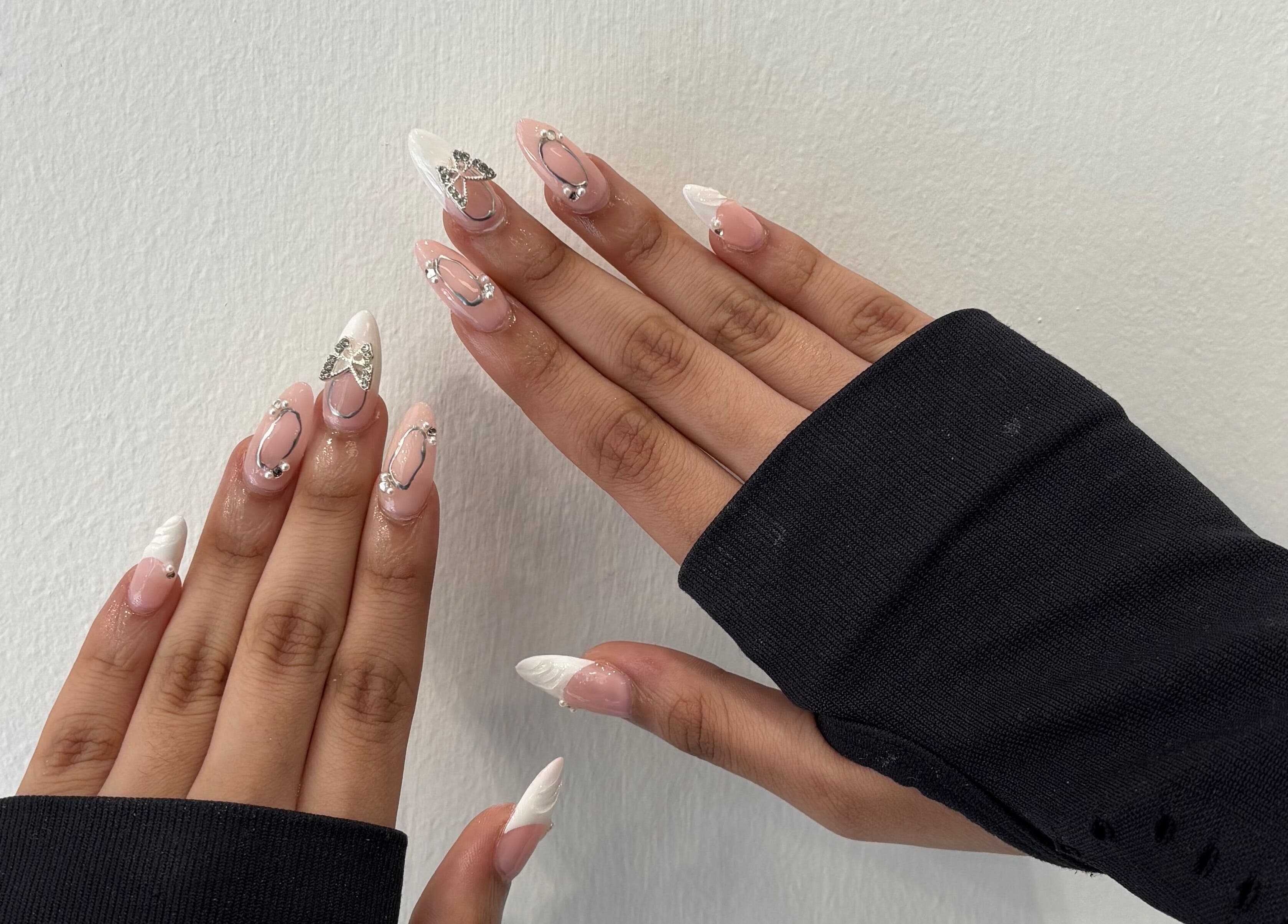 Elegant nail art with white and silver accents at Blush Dundee, Dundee, Scotland, GB.