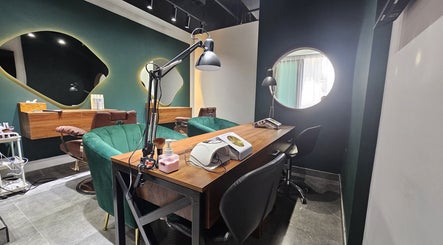 Modern interior of The Elenas Beauty Salon, Dubai, Dubai, AE, featuring chic styling chairs and sleek mirrors.