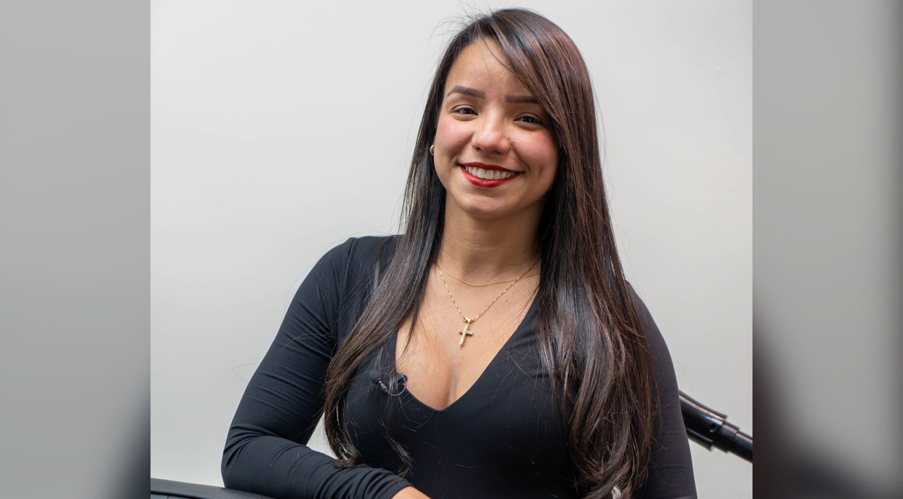 Smiling stylist at Africa Barber Girl, Montebello, California, US, ready to provide exceptional service.