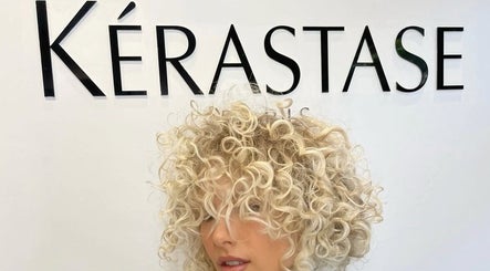 Blonde curly hairstyle showcased at The Colour House, Sydney, New South Wales, AU. Perfect for modern beauty.