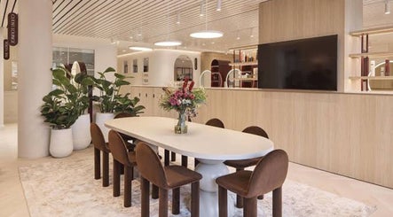 Stylish meeting area at The Colour House, Sydney, New South Wales, AU featuring modern decor and lush greenery.