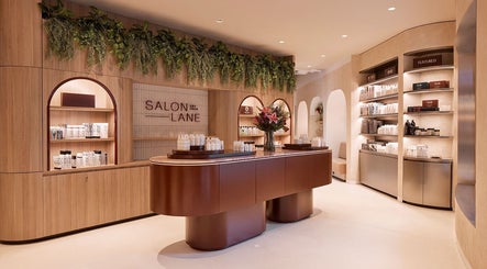 Modern salon interior at The Colour House, Sydney, New South Wales, AU showcasing elegant wooden fixtures and products.