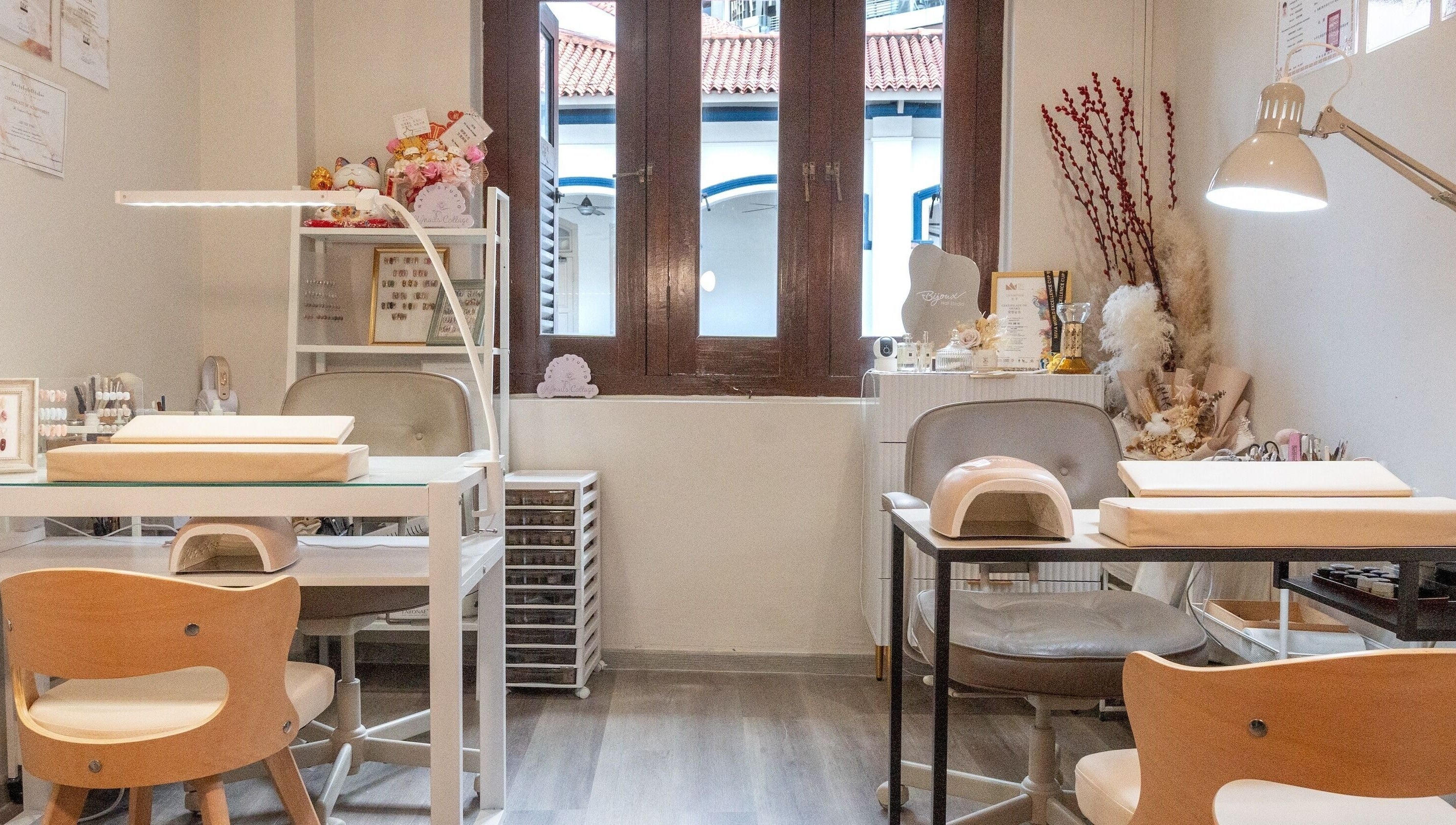 Interior view of Bijoux Nail Studio, Singapore, SG; stylish manicure stations with elegant decor.