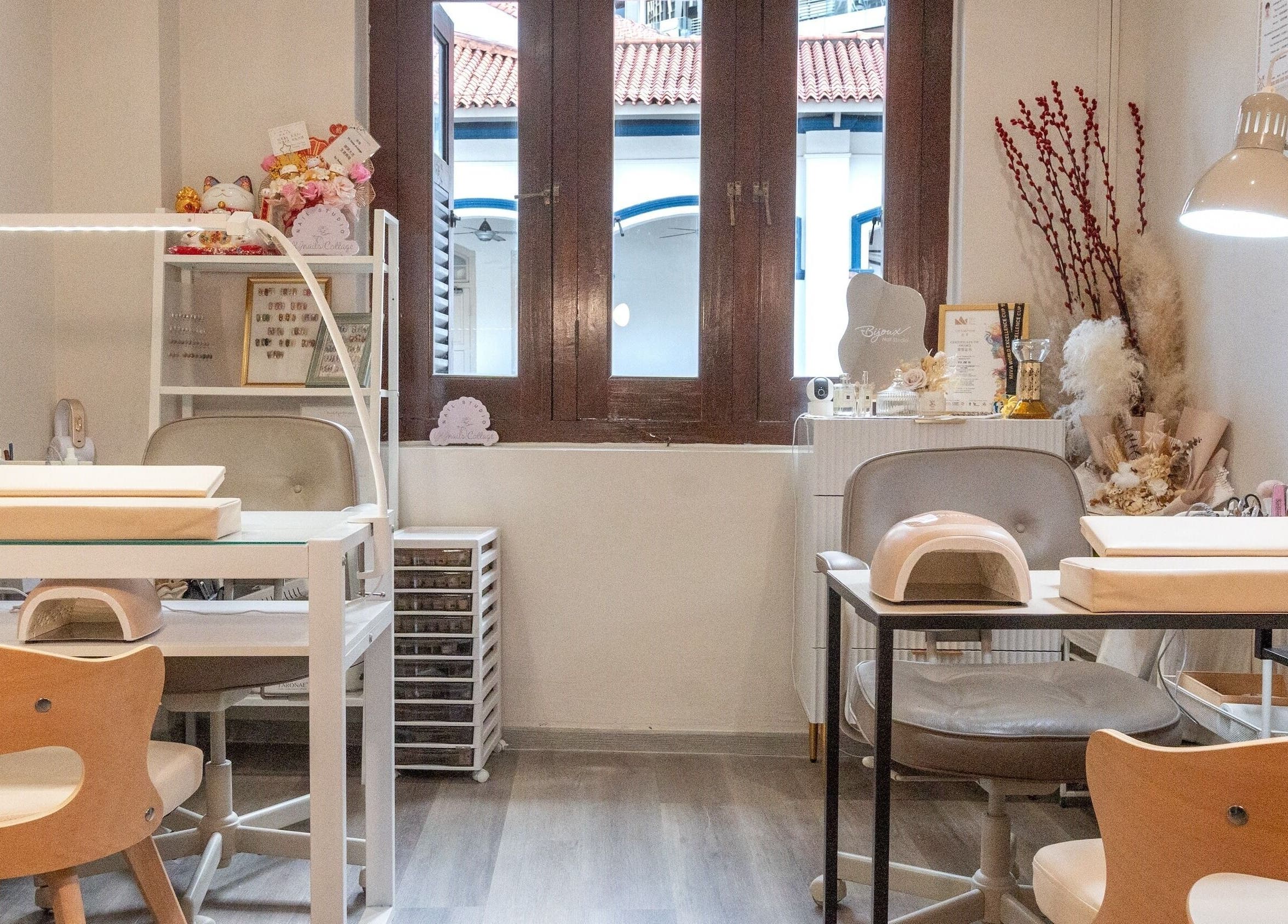 Interior view of Bijoux Nail Studio, Singapore, SG; stylish manicure stations with elegant decor.
