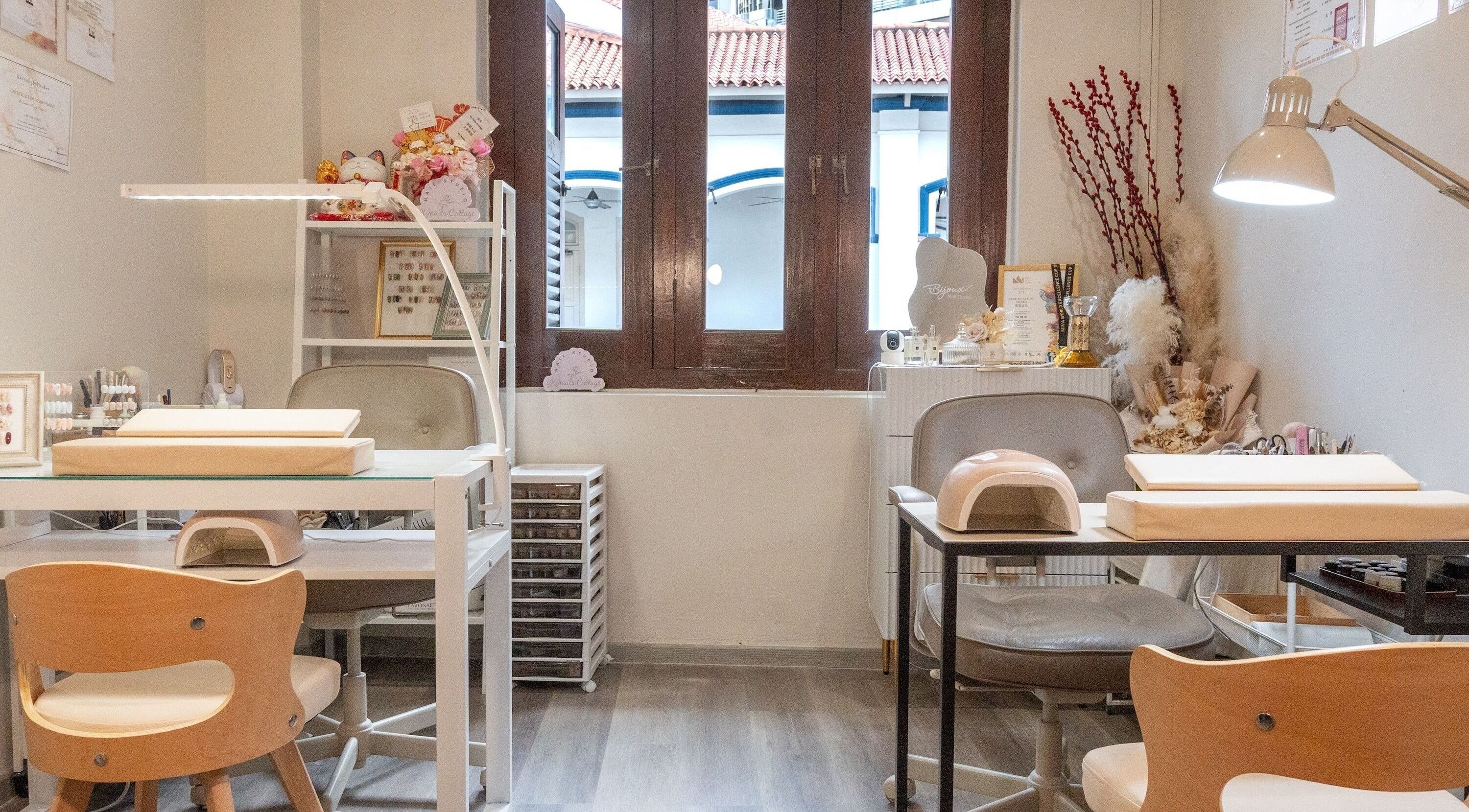 Interior view of Bijoux Nail Studio, Singapore, SG; stylish manicure stations with elegant decor.