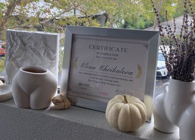 Certificate and decor at Divine Contours Studio, Citrus Heights, California, US. Scenic and tasteful setup.