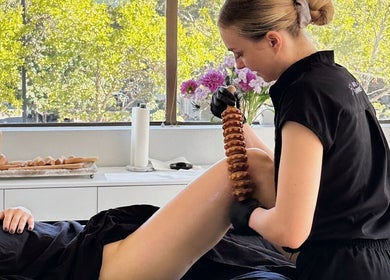 A therapist at Divine Contours Studio in Citrus Heights, California, performs a calming massage technique.