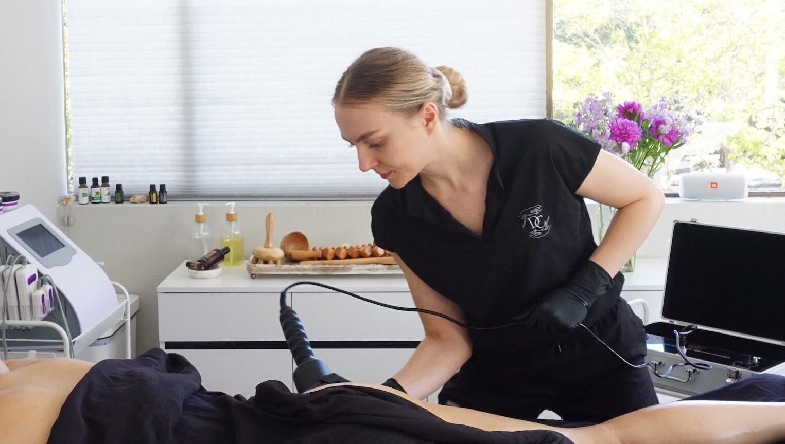 Therapist performing treatment at Divine Contours Studio in Citrus Heights, California, US.