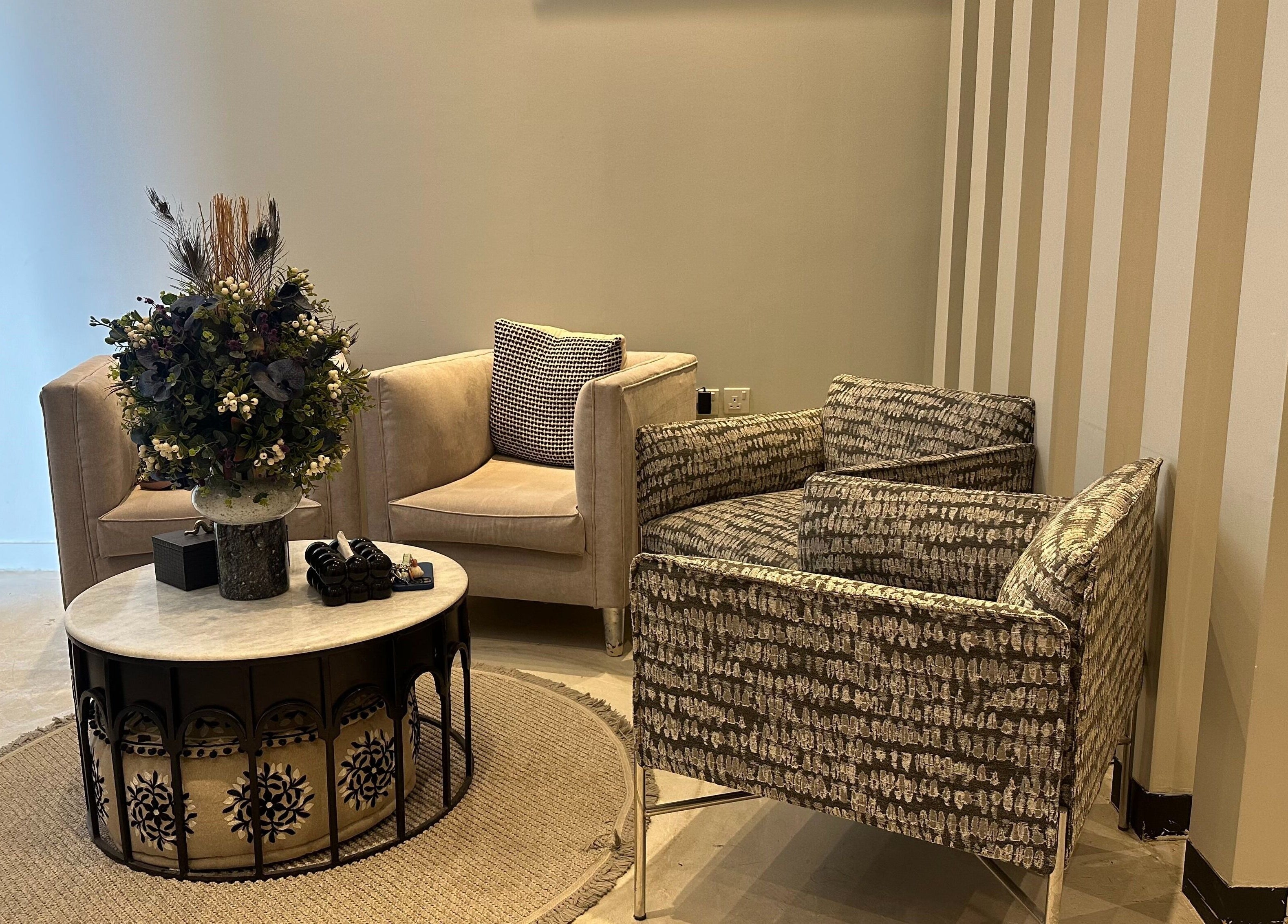 Elegant seating area at Purple Nail Spa Alyasmin, Riyadh, Riyadh Province, SA featuring plush chairs and chic decor.