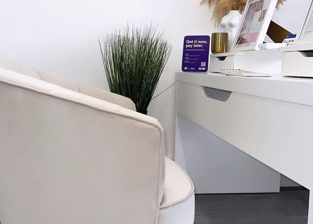 Modern workspace with chair and plants at Sculpt Aesthetics, Sunderland, England, GB.