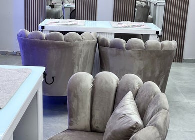 Chic velvet chairs at Luxxe Beauty Spot, Roodepoort, Gauteng, ZA, showcasing modern elegance and comfort.