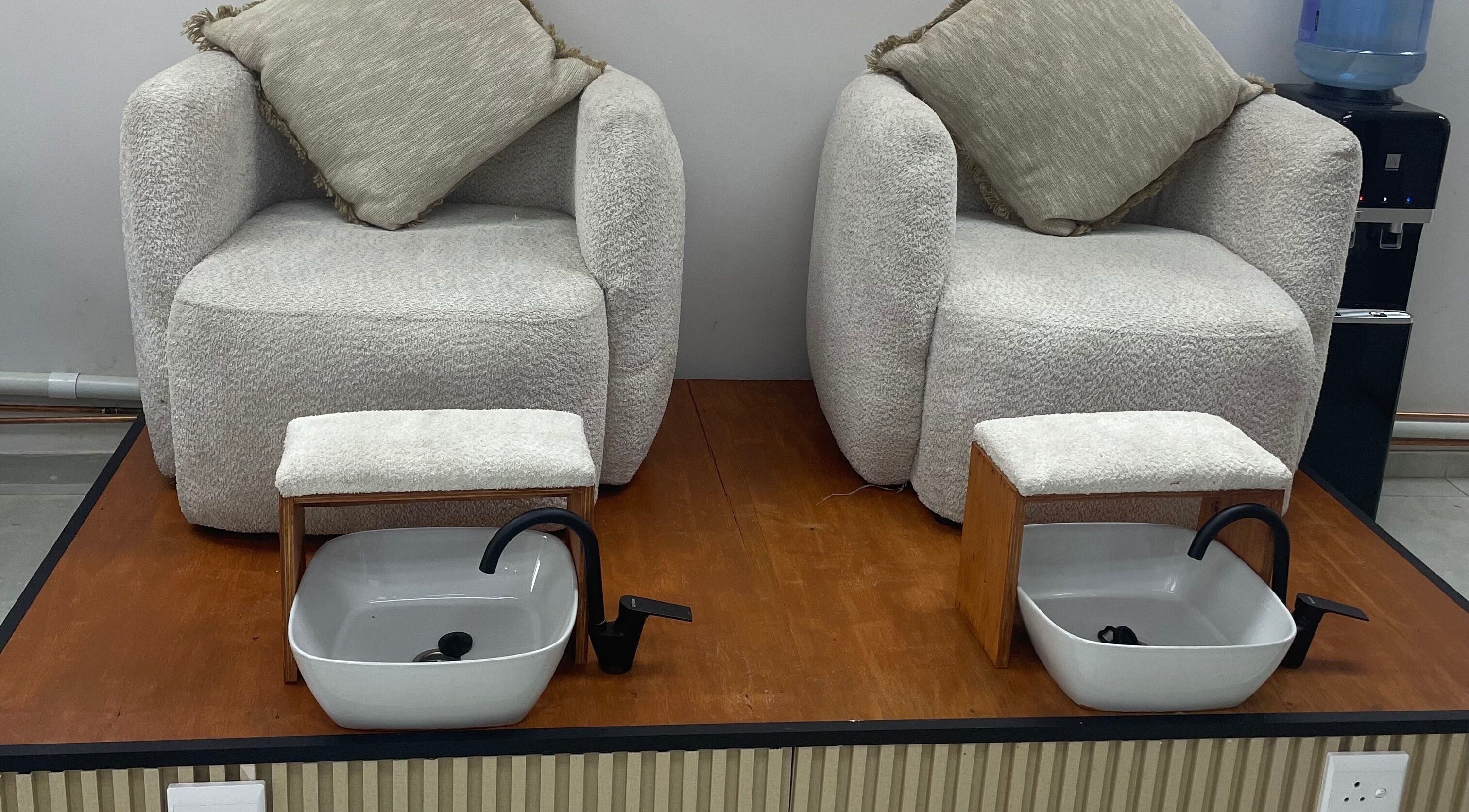 Luxxe Beauty Spot pedicure chairs in Roodepoort, Gauteng, ZA with plush seating and foot basins.
