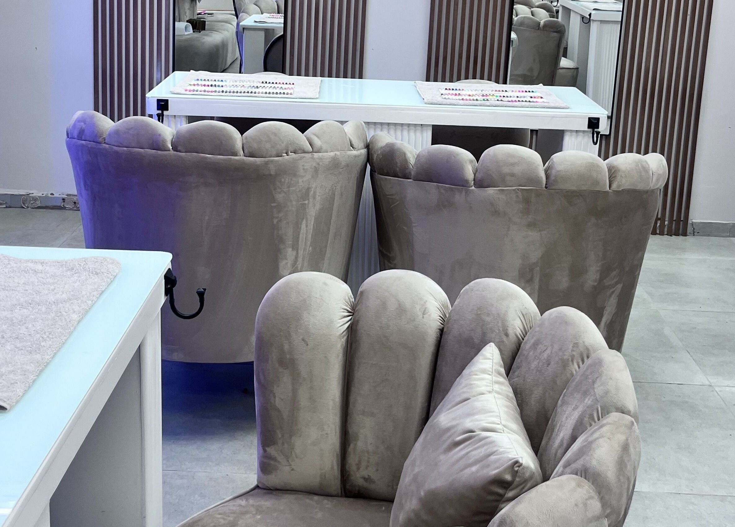 Luxxe Beauty Spot's plush velvet chairs in Roodepoort, Gauteng, ZA create a luxurious and serene atmosphere.