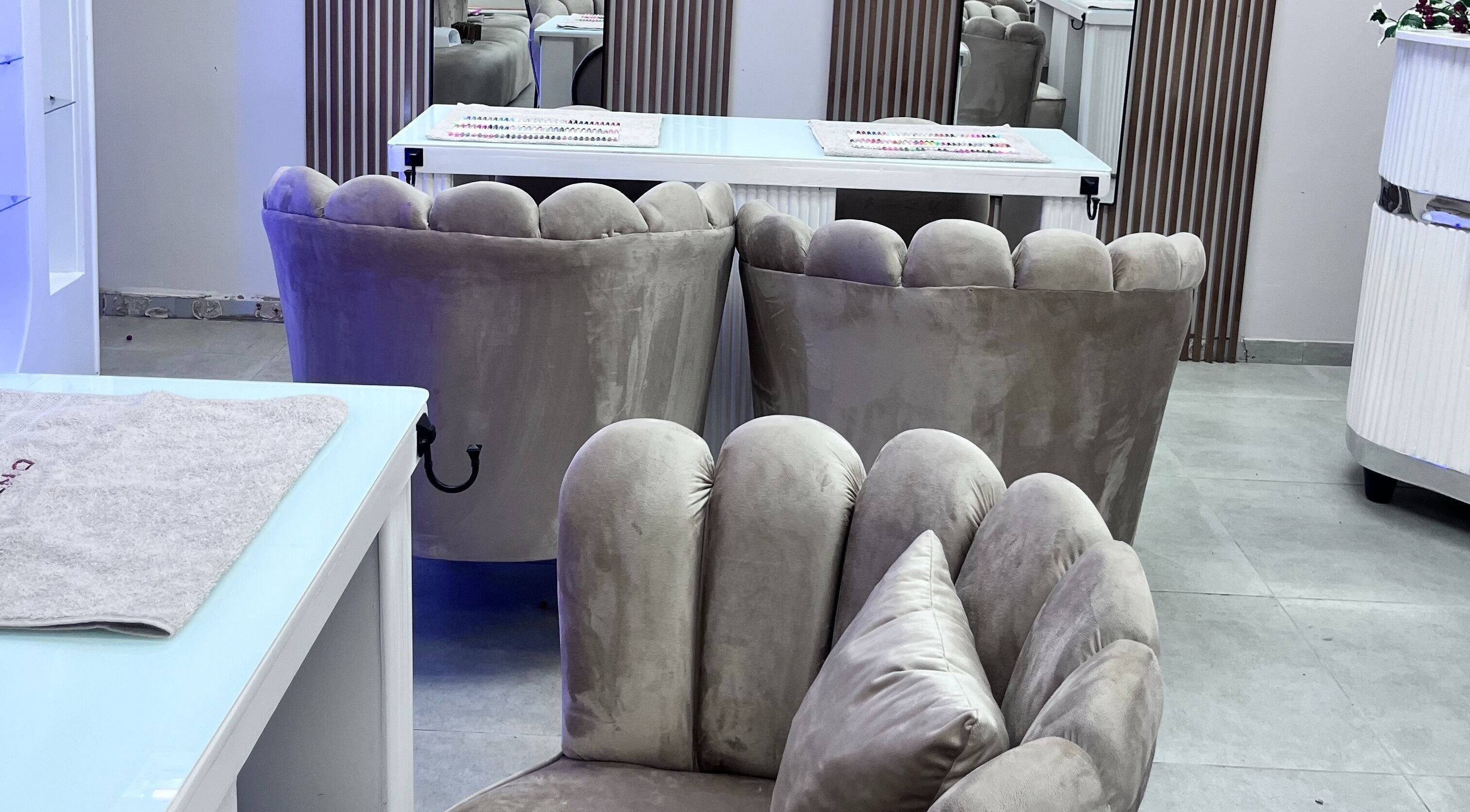 Luxxe Beauty Spot's plush velvet chairs in Roodepoort, Gauteng, ZA create a luxurious and serene atmosphere.